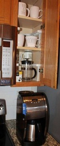 lot 55 image: Cuisinart coffee maker and mugs as shown