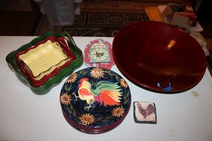lot 73 image: Rooster plates by Susan Winget CIC, red wooden bowl, Nesting serving dishes, and small wall clock