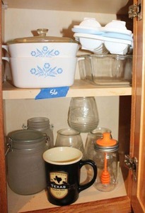 lot 56 image: Vintage CorningWare baking dishes, ice molds, honey jar, Texas mug and more