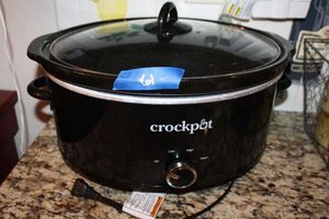 lot 61 image: Black oval crock pot