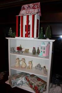 lot 99 image: Christmas decorations, pink fairy figurines, and storage boxes