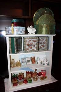 lot 102 image: Christmas storage containers and decorative gift boxes plus Cassette tapes