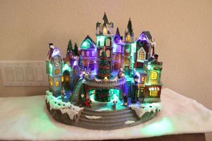 lot 8 image: Christmas village all-in-one piece with music and lights