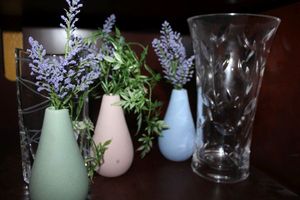 lot 31 image: Crystal vases, candle holders, small colored vases