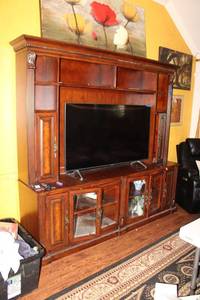 lot 29 image: LARGE entertainment cabinet only (picture shows 55 TV, there just for size comparison) - 82.5W x 19.5 D x 80.5H. 2 piece unit. Bring Help and Equipment