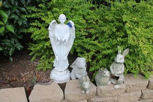 lot 177 image: Bunny statues and angel statue
