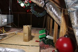 lot 195 image: Christmas wreathes, wrapped gift presents, large red plastic ornament