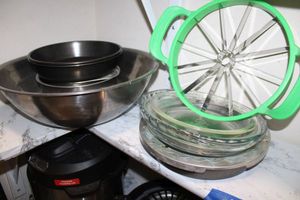 lot 45 image: Watermelon slicer, pie plates and metal mixing bowls