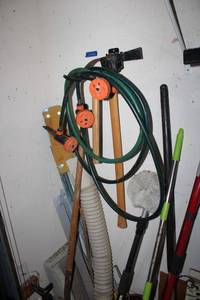 lot 282 image: Watering sprayer, car wash brush (attaches to hose), garden axe tool