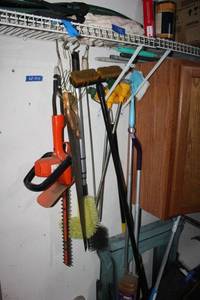 lot 274 image: Yard bush trimmer, hand saw, brushes, watering stakes