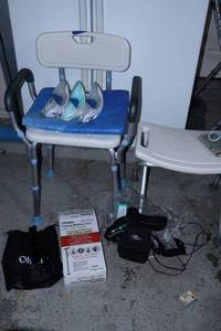 lot 265 image: Shower chairs, suction handles, lighted folding cane, and medical devices