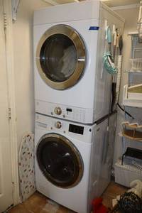 lot 47 image: Stackable washer and dryer set (some cosmetic damage, see photos)