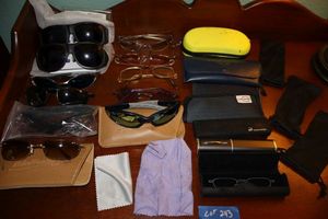 lot 243 image: Sunglasses and eyeglasses plus cases