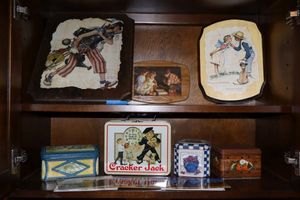 lot 219 image: Wood wall art pictures, Cracker Jack lunch box and small tins plus postcards