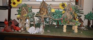 lot 159 image: Birdhouse sculptures plus cardinal birds and bunny figurines