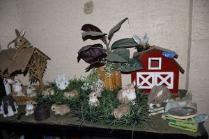 lot 131 image: Decorative barn and well with bunny figurines