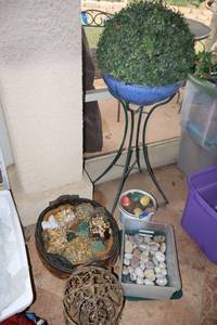 lot 144 image: Metal stand with round planter with craft andor garden rocks
