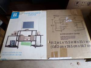 lot 10 image: 6 Shelf Entertainment Center, Unassembled., Assembles in Minutes, About 52x16x23