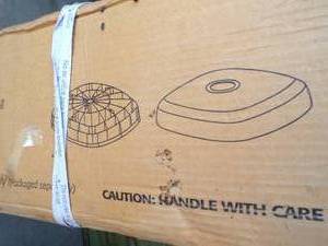 lot 7 image: Treasure Garden  AKZ-00 Bronze Umbrella Base, 2 Piece Polypropylene Shell, New in Box