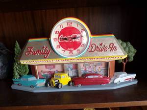 lot 44 image: Coca Cola Family Drive In Clock, Plastic, Uses 1 AA Battery, About 20x2x10.5