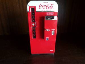 lot 48 image: 1994 Coca Cola Enesco Die Cast Vendo Vending Machine Musical Bank, Plays Its The Real Thing, Uses 2 AA Batteries, About 3.5x3.5x7