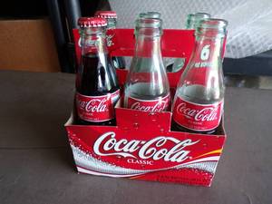 lot 74 image: 6 Pack of Vintage 8 oz. Coca Cola Bottles in Carton, 2 Filled and Capped, 4 Are Filled and Uncapped