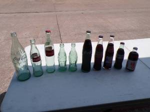 lot 82 image: Lot of 10 Vintage Coca Cola, Coke, Diet Coke Bottles, 5 Full and 5 Empty, Mixed Sizes and Styles