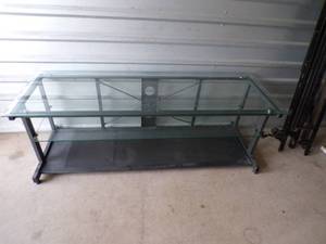 lot 33 image: Metal and Glass TV Stand, Metal Bottom With 2 Glass Shelves, About 63x22x21