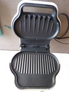 lot 128 image: George Foreman Lean Mean Fat Reducing Grilling Machine With Accessories
