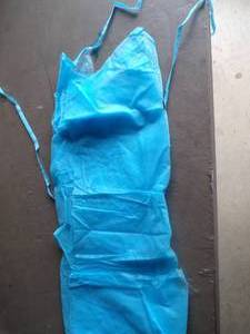 lot 139 image: Box of 100 Blue Non-Woven Exam Gowns, 10 Packs of 10, One Size Fits All