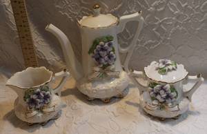 lot 56 image: tea set of 3 with raised purple flowers