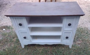 lot 93 image: believe this is a small tv table with drawers or computer table