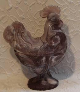 lot 64 image: vintage large, molded chicken dish purple with white swirls lava glass has a small chip pic of outside and inside same small chip
