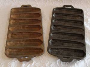 lot 121 image: two-Vintage-Cast Iron-Cornbread-Corn Cob-Mold-Kitchen Decor