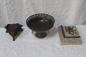 lot 230 image: decorative metal pedestal bowl with a lion on it and a stone table wall art with Lion and more see pictures