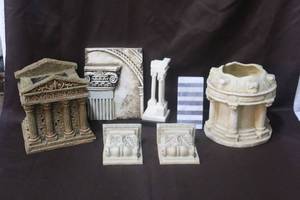 lot 256 image: decorative planter or vase, likely made of concrete or a similar material, designed to resemble a classical architectural element and much more see all pictures