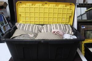 lot 265 image: 40 gal tote full of throw pillows and curtain linens and more