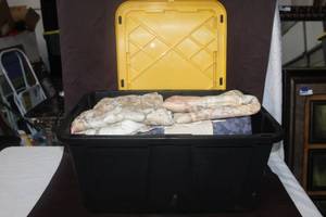 lot 266 image: 27 Gal tote full of pillow cases table lens unopened four piece set of sheets and blanket and much more