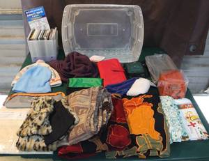 lot 328 image: Mixed lot of hats change purses CDs and more see photo