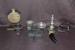 lot 363 image: Huge Vintage magnifying glass hand held faux horn  and Vintage T-7 Tulip Black Cast Iron Trivet  Footed with Hearts and much more see pictures