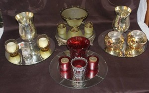 lot 379 image: Mixed Lot of mirror displays with mixed lot of candle holders