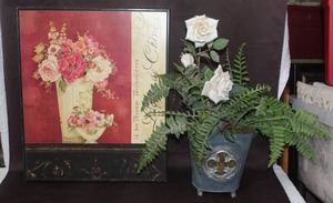 lot 442 image: Metal flower pot with faux flowers and a wall picture