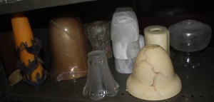 lot 500 image: Shelf full of glass light fixtures