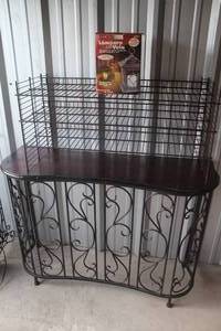 lot 523 image: Hall table with metal frame wood top and metal shelf and a lantern