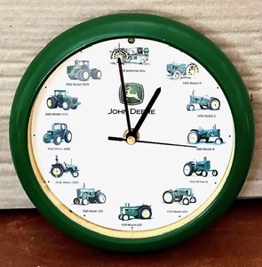 lot 10 image: JOHN DEERE Plastic Green Rim Tractor Clock with Tractor Sounds on the Hour