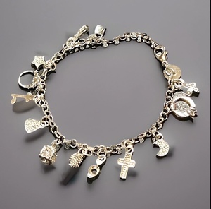 lot 25 image: .925 Sterling Silver Charm Bracelet WCharms