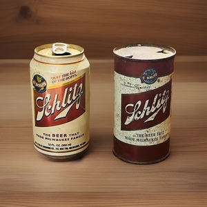 lot 26 image: Vintage 1940s Schlitz Beer 12oz Can &amp Vintage Schlitz Can with Just the KISS of the Hops