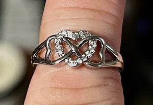 lot 63 image: Sparkling Heart Shape &amp Infinite Design .925 Sterling Silver Ring