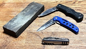 lot 68 image: Three Assorted Pocket Knives - Including an Imperial Ireland - &amp a Whetstone
