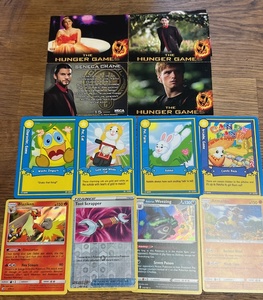 lot 120 image: 3 Pokemon Foil Cards, Webkinz Cards&amp Hunger Games Cards